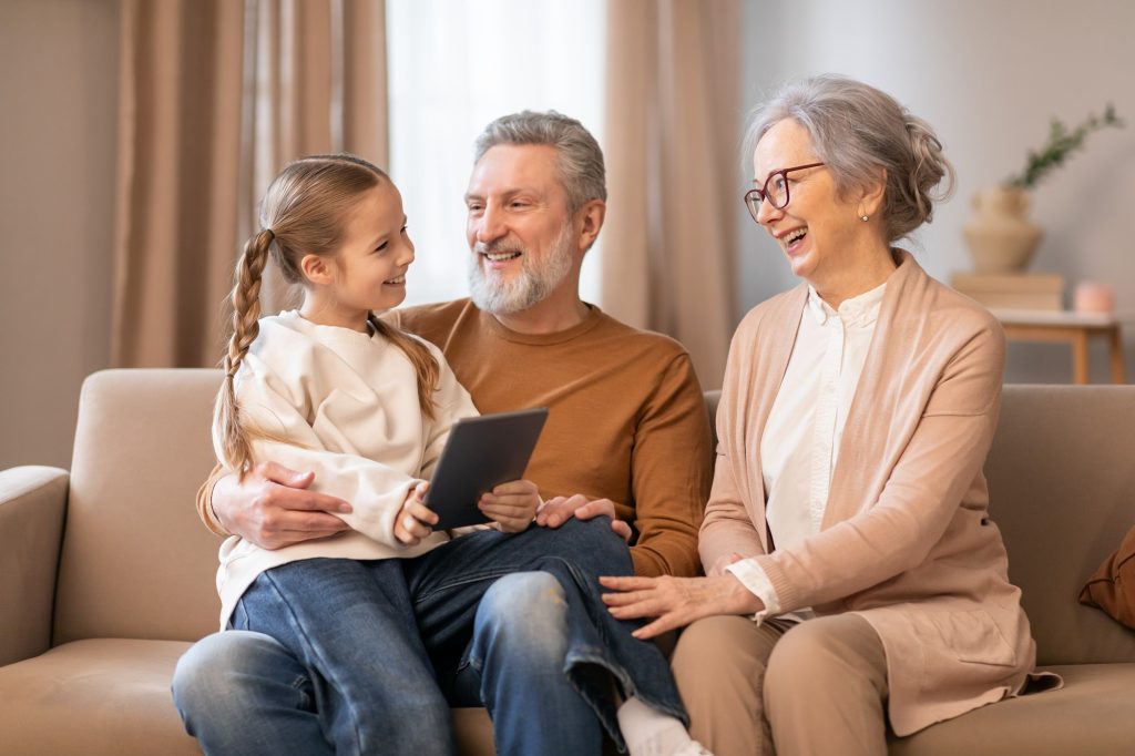 Senior sharing wisdom and stories with family